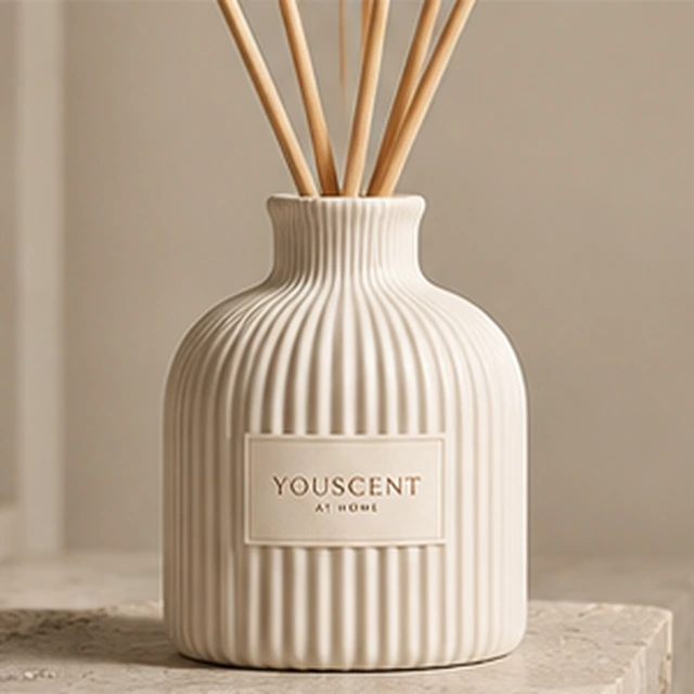 The Flute reed diffuser, warm ivory. deep ceramic ribs. Label saying Made yours.